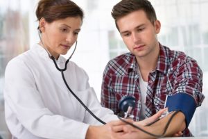 checking blood pressure